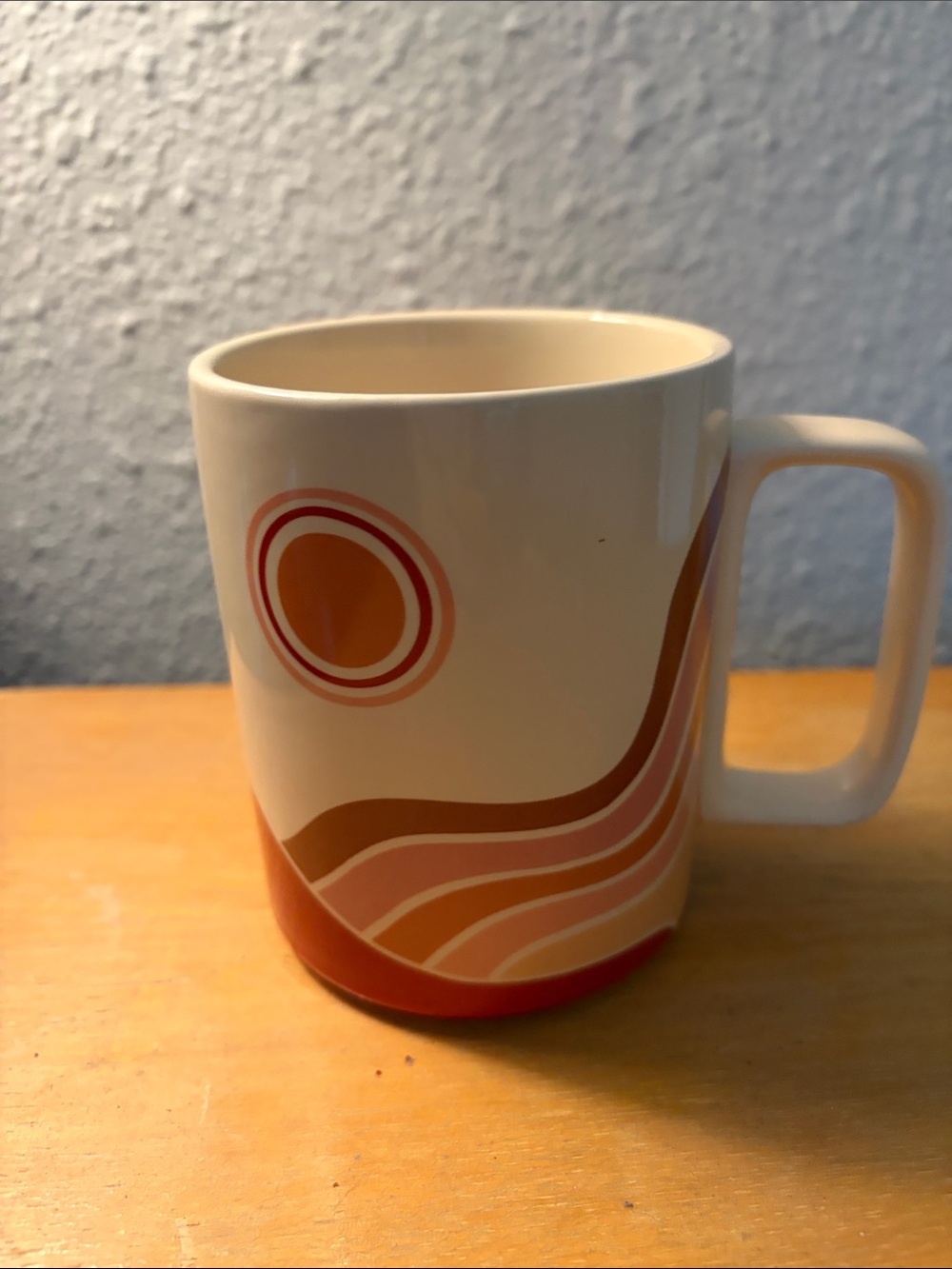 Cream Ceramic Mug with Retro Orange and Pink Wave Design
